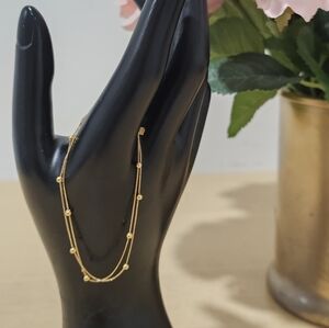 18k real saudi gold bracelet  With 9 Gold Beads size 6.5